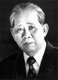 Lê Duẩn (7 April 1907 – 10 July 1986) was a Vietnamese communist politician. He rose in the party hierarchy in the late 1950s and became General Secretary of the Central Committee of the Communist Party of Vietnam (VCP) at the 3rd National Congress in 1960. He continued Hồ Chí Minh's policy of ruling through collective leadership. From the mid-1960s, when Hồ's health was failing, until his own death in 1986, he was the top decision-maker in Vietnam.<br/><br/>

He was born into a lower-class family in Quảng Trị province, in the central part of French Indochina as Lê Văn Nhuận. Little is known about his family and childhood. He first came in contact with Marxist literature in the 1920s through his work as a railway clerk. Lê Duẩn was a founding member of the Indochina Communist Party (the future Communist Party of Vietnam) in 1930. He was imprisoned in 1931 and released in 1937. From 1937 to 1939 he climbed the party ladder. He was rearrested in 1939, this time for fomenting an uprising in the South. Lê Duẩn was released from jail following the successful communist-led August Revolution.<br/><br/>

During the First Indochina War, Lê Duẩn was an active communist cadre in the South. He headed the Central Office of South Vietnam, a party organ, from 1951 until 1954. During the 1950s Lê Duẩn became increasingly aggressive towards the South and called for reunification through war. By the mid-to-late 1950s Lê Duẩn had become the second-most powerful policy-maker within the Party, eclipsing former party First Secretary Trường Chinh. By 1960, he was officially the second-most powerful party member, after party chairman Hồ. Throughout the 1960s Hồ's health declined and Lê Duẩn assumed more of his responsibilities. On 2 September 1969, Hồ died and Lê Duẩn became the most powerful figure in the North.<br/><br/>

Throughout the Vietnam War, Lê Duẩn took an aggressive posture. He saw attack as the key to victory. When the North finally won the war in 1975, Lê Duẩn and his associates were overly optimistic about the future. The Second Five-Year Plan (1976–1980) was a failure and left the Vietnamese economy in crisis. Vietnam was then headed by a gerontocracy (in which the rulers are much older than the average adult). Vietnam became internationally isolated during Lê Duẩn's rule. In 1979 the country had invaded Kampuchea and ousted Pol Pot, fought a war with China and became dependent on Soviet economic aid. Lê Duẩn died in 1986 and was succeeded by Trường Chinh in July.